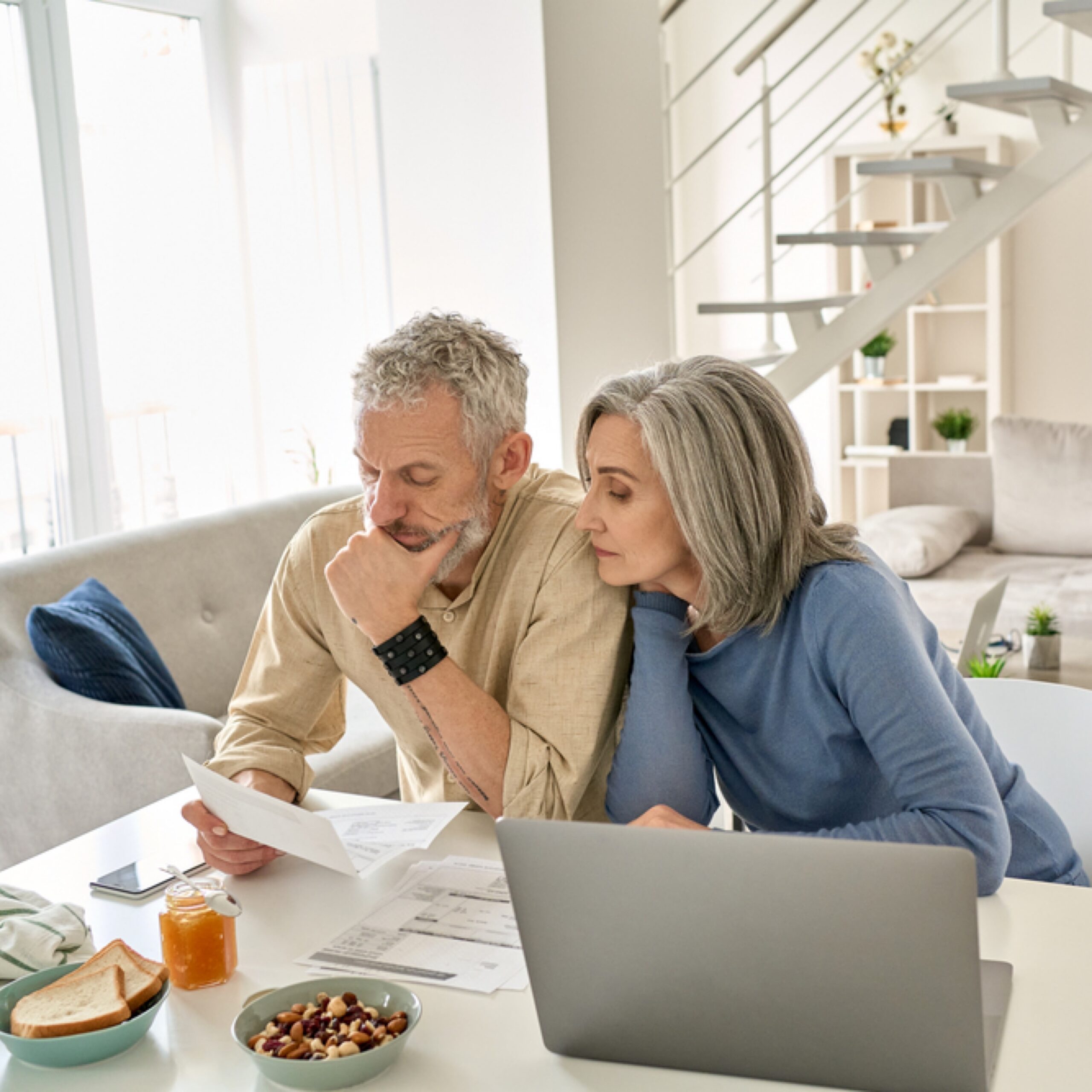 Couple wondering how to sell and buy at the same time.